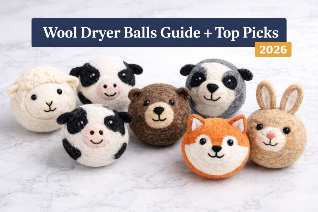 Six XL wool dryer balls with cute animal faces arranged in a semi-circle on a white marble surface with a headline about wool dryer ball benefits and top picks.